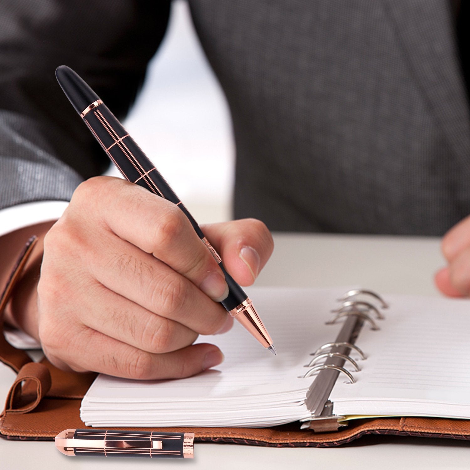 Croton Ballpoint Pen with laser cut grooves in matte black and rose accents - CROTON GROUP